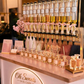 Display of skincare products on a counter with 'Oh Sweets' branding.